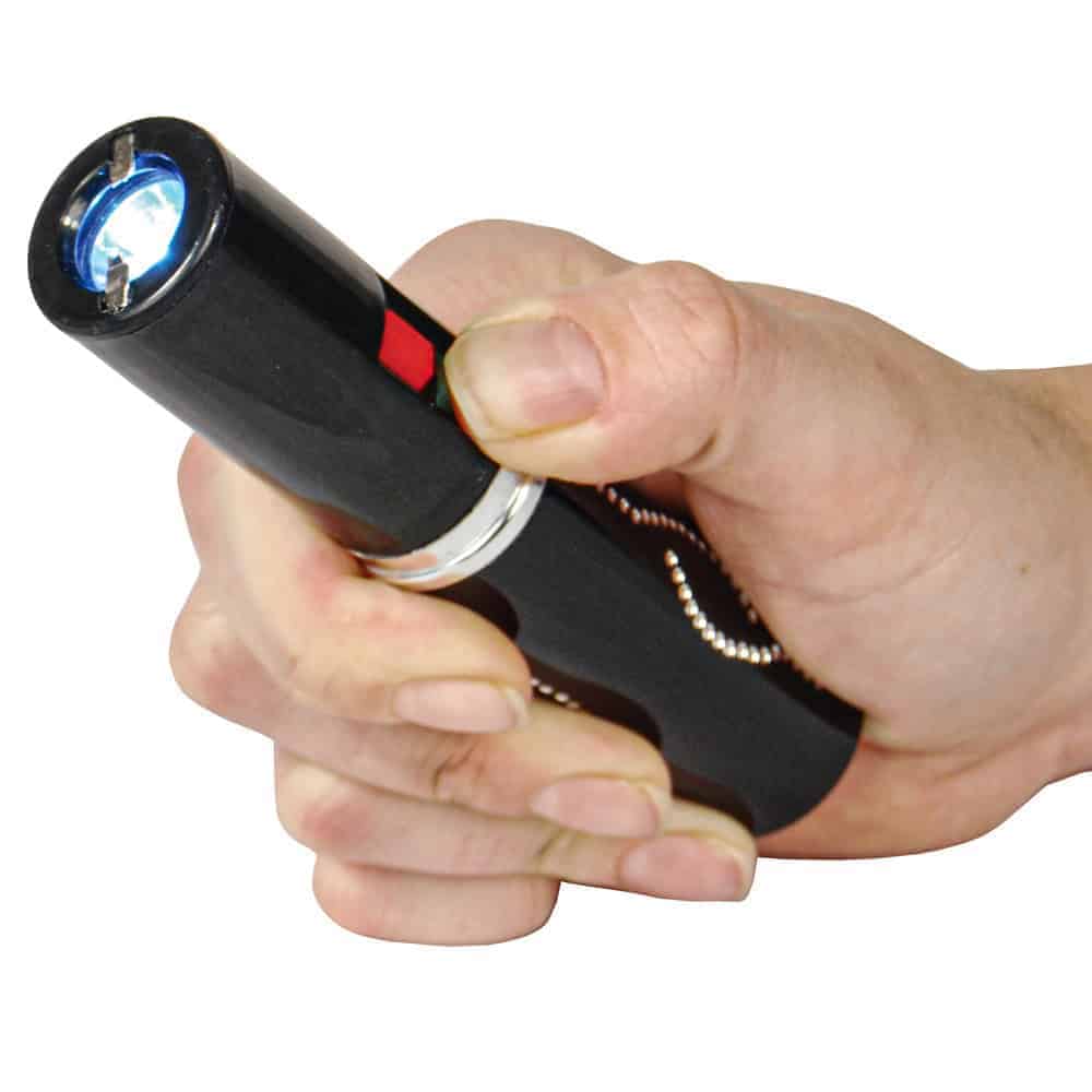 Black 25 Million Volt Lipstick Stun Gun Rechargeable With Flashlight Shown in Hand