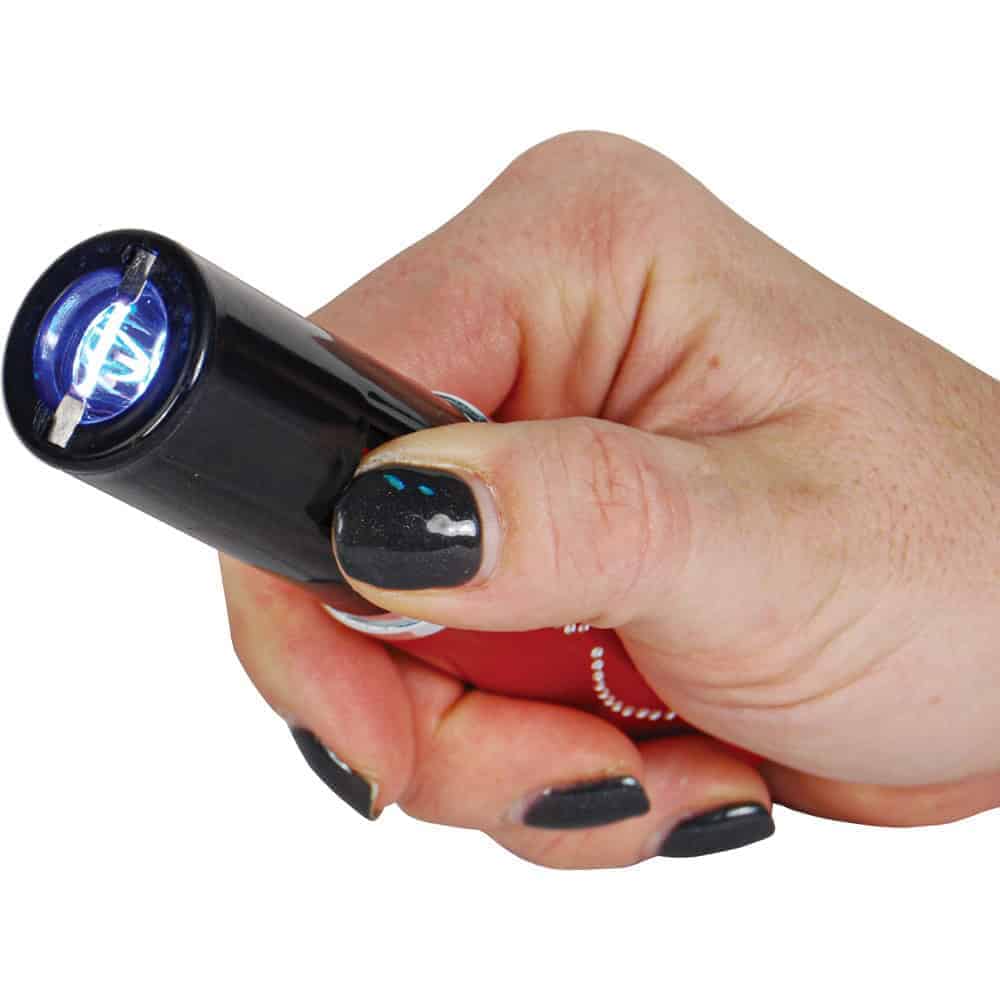 Red 25 Million Volt Lipstick Stun Gun Rechargeable With Flashlight Shown in Hand