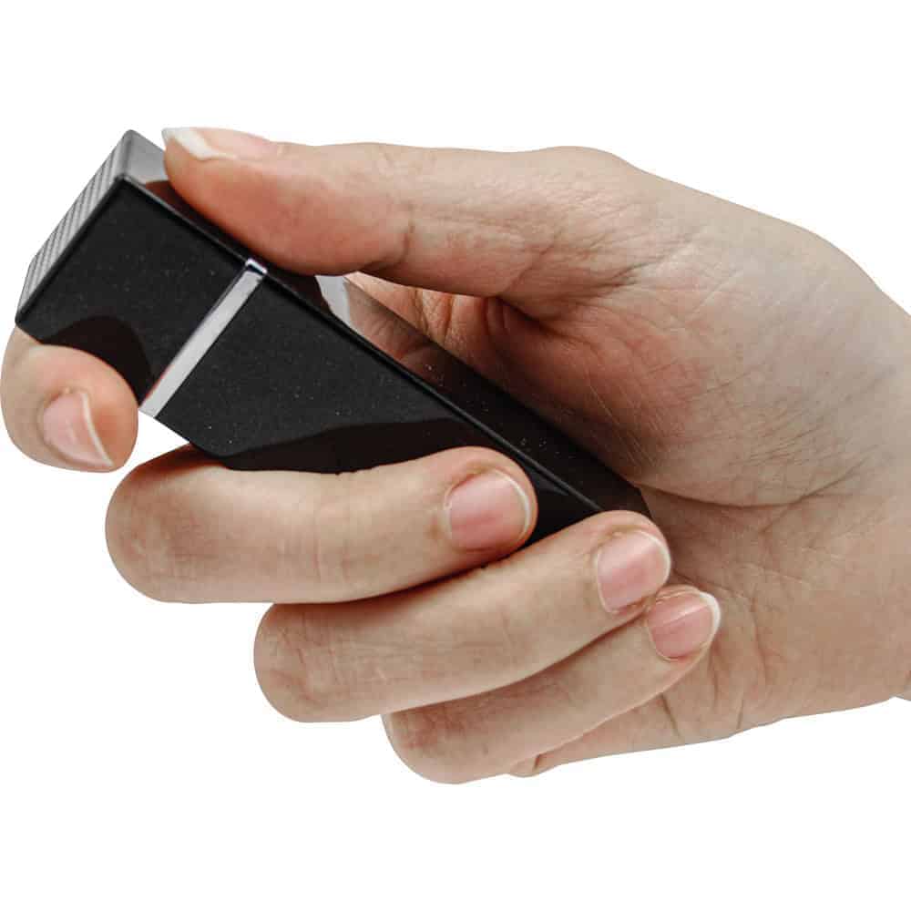 Black 90 db Lipstick Alarm Shown in Hand