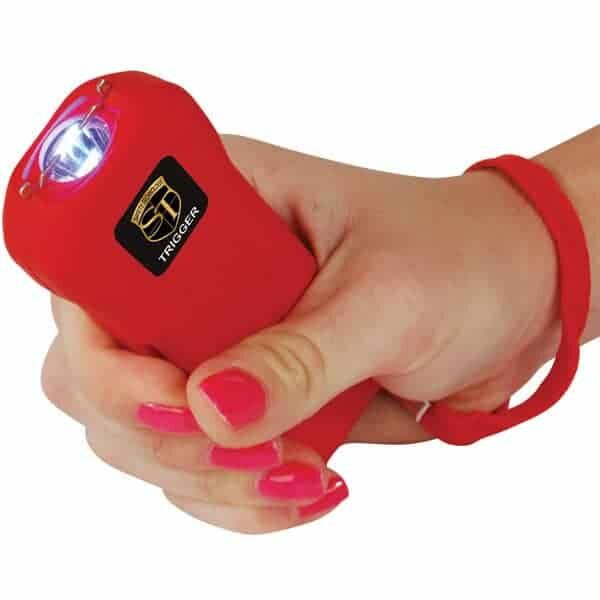 Red 75 Million Volt Trigger Stun Gun Flashlight with Disable Pin Shown in Hand