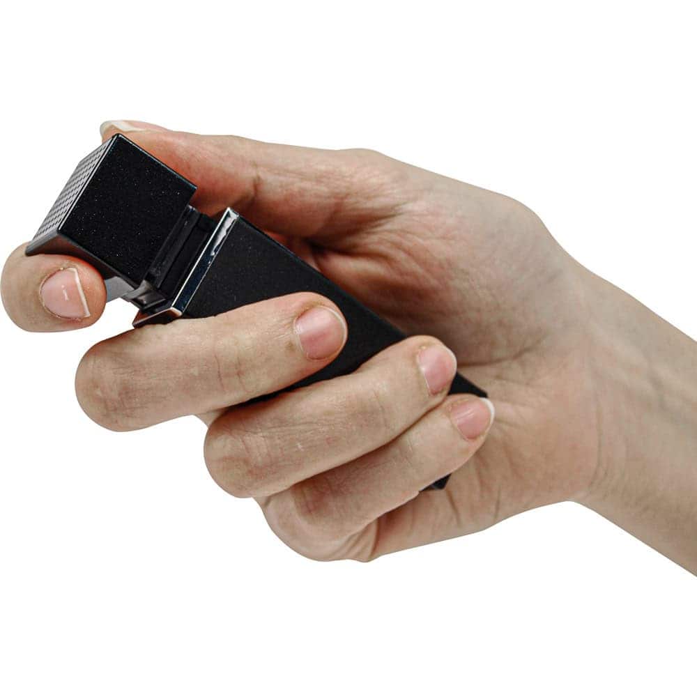 Black 90 db Lipstick Alarm Shown in Hand | Advanced Safety Tech Black 90 Db Lipstick Alarm Shown in Hand Advanced Safety Tech Black 90 Db Lipstick Alarm Shown in Hand