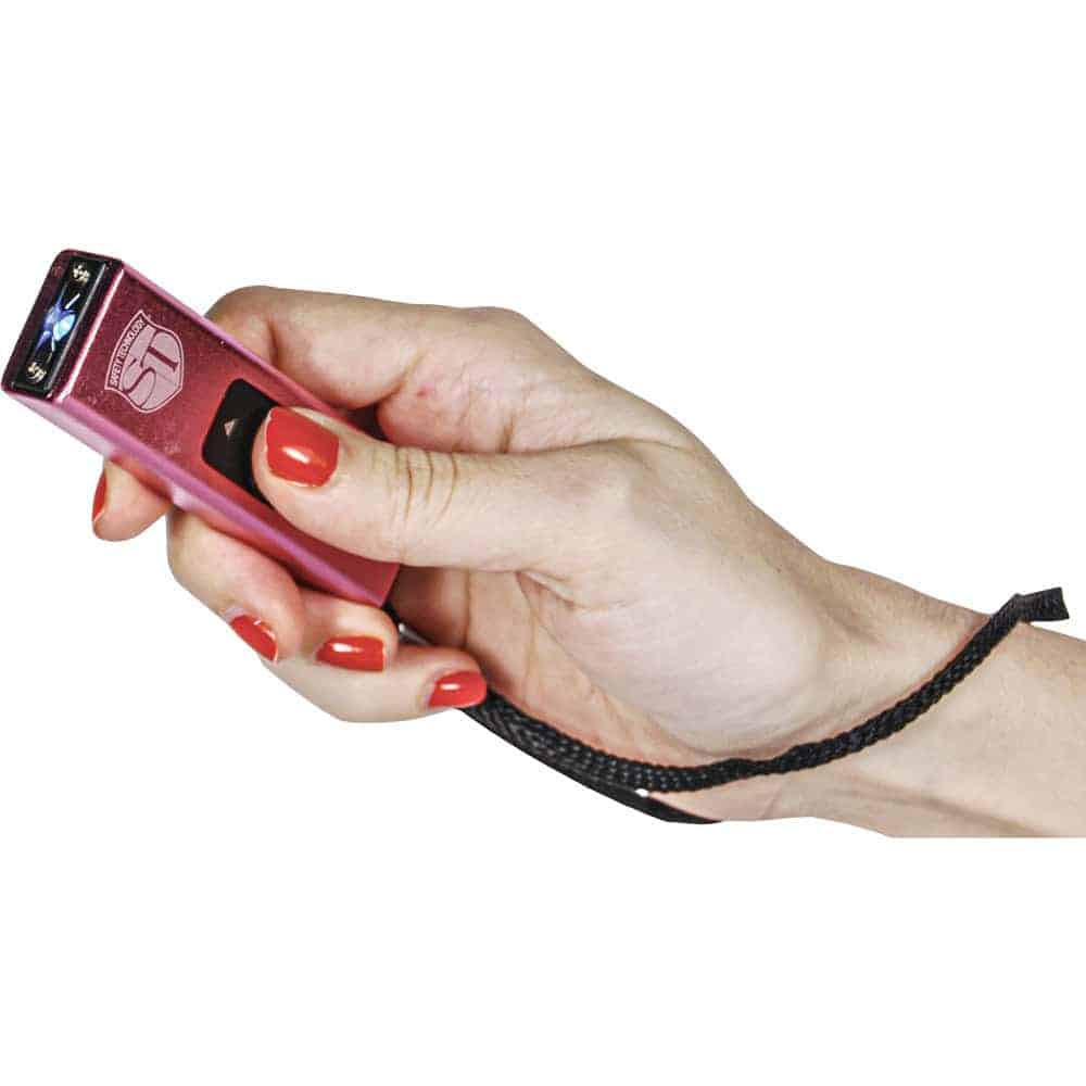 Pink Slider Stun Gun with LED Flashlight USB Rechargeable Shown in Hand | Advanced Safety Tech Pink Slider Stun Gun with Led Flashlight Usb Rechargeable Shown in Hand Advanced Safety Tech Pink Slider Stun Gun with Led Flashlight Usb Rechargeable Shown in Hand