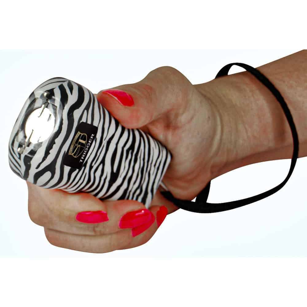 Zebra 75 Million Volt Trigger Stun Gun Flashlight with Disable Pin Shown in Hand | Advanced Safety Tech Zebra 75 Million Volt Trigger Stun Gun Flashlight with Disable Pin Shown in Hand Advanced Safety Tech Zebra 75 Million Volt Trigger Stun Gun Flashlight with Disable Pin Shown in Hand
